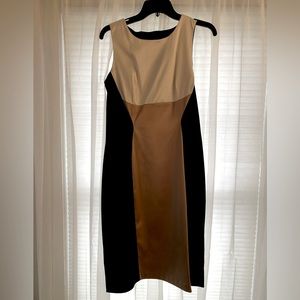 Beautiful fitted dress. Color block in gold, black and white. Size 12